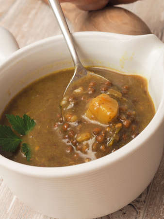 Soup of green lentils with potaoes and spicy herbsの写真素材