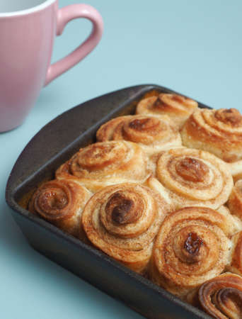 Sweet and tasty cinnamon pastry in a ceramic baking dish