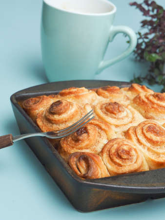 Sweet and tasty cinnamon pastry in a ceramic baking dishの写真素材