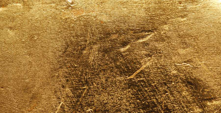 In gold painted wood texture using as luxury or festive background