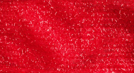 Red fabric using as glittering Christmas texture background