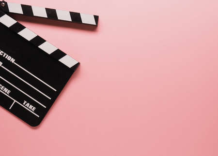 Clapboard on a pink background, cinema or movie conceptの写真素材