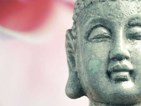Close up of a statue of buddha with space for text, spiritual or traditional conceptの写真素材