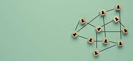 Abstract teamwork, network and community concept on a green paper background with space for textの写真素材