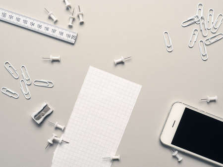 Office utensils on a grey background with space for textの写真素材