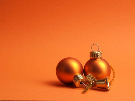 Orange vintage Christmas baubles on an orange background with space for your text or image, seasonal holiday conceptの写真素材