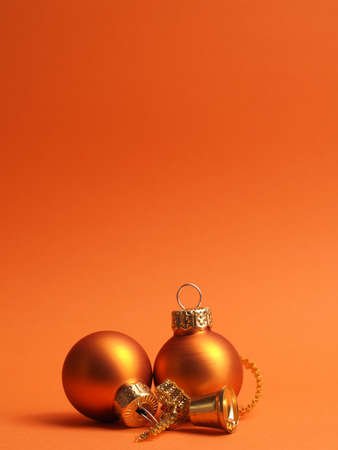 Orange vintage Christmas baubles on an orange background with space for your text or image, seasonal holiday conceptの写真素材