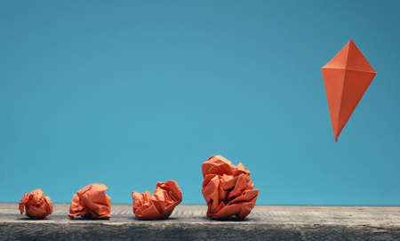 New ideas or transformation concept with crumpled paper and paper kite, business, teamworkの写真素材