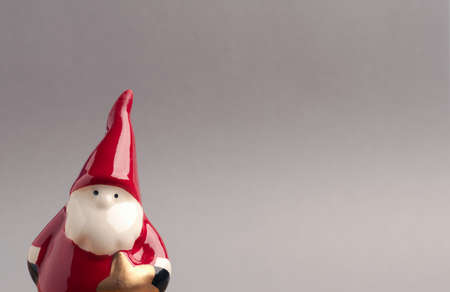 Funny Santa on a gray background with space for text, seasonal holidays Christmas card backgroundの写真素材