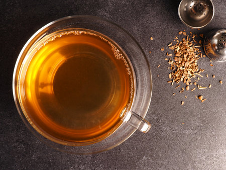 Tea glass with organic chai tea on a stone table, view from above, healthy food conceptの写真素材
