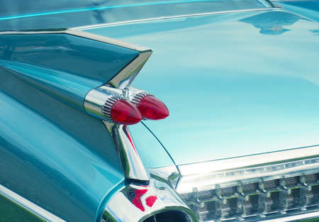 Taillight of an old classic American car, wide angle shot on a sunny summer dayの写真素材