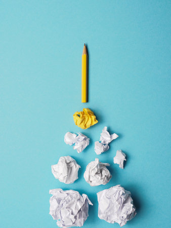 Launching pencil rocket with jet stream of paper balls, creativity concept or new ideas metaphor, start up business, new years resolutionの写真素材