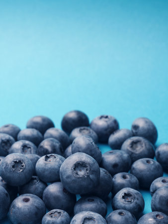 A bunch of blueberries on a blue background, super food, healthy eating concept, anitoxidants,...