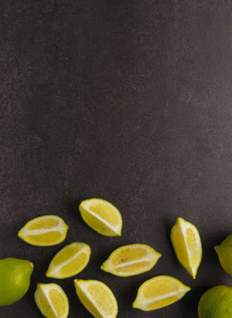 Fresh organic lime fruit on a dark stone backdround with space for text