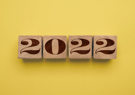 Wooden cubes with the Year number 2022, New Year concept, seasonal Christmas time