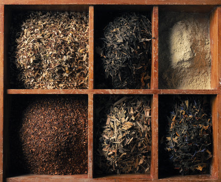 Different kinds of tea in the wooden box, view from aboveの写真素材