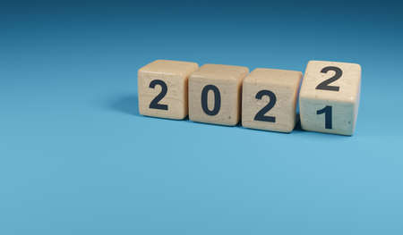 Flipping wooden cubes with the Year number 2021 and 2022, New Year concept, 3d renderingの写真素材