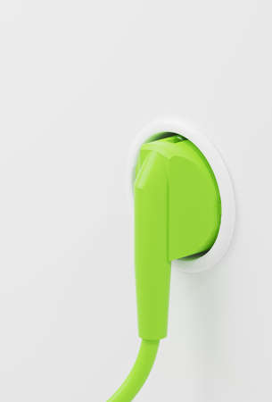 Green plug in a wall socket, green energy concept, energy transition, renewable electricity, 3d renderingの写真素材