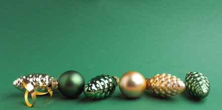 Vintage Christmas baubles on a green background with space for your text or image, seasonal holiday conceptの写真素材