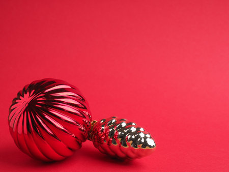 Vintage Christmas baubles on a red background with space for your text or image, seasonal holiday conceptの写真素材