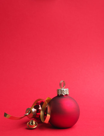 Vintage Christmas baubles on a red background with space for your text or image, seasonal holiday conceptの写真素材