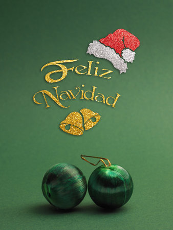 Green vintage Christmas baubles on a green background with text Feliz Navidad, seasonal holiday conceptの写真素材
