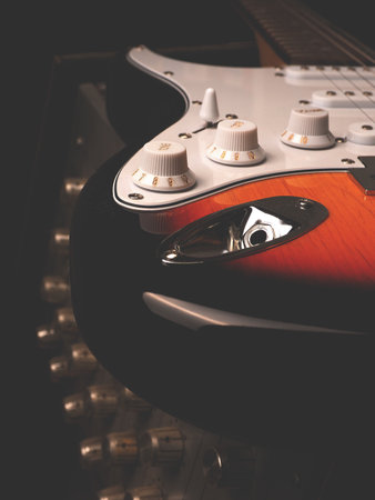 Vintage electric guitar on an old guitar amplifier in a studioの写真素材