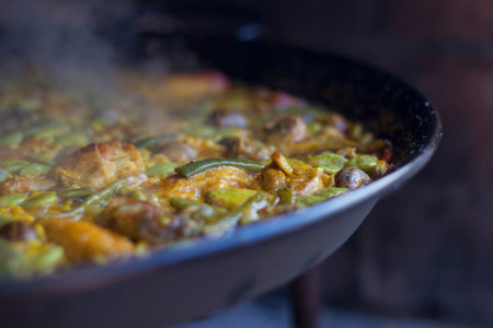 typical Valencian paella cooked with firewoodの写真素材