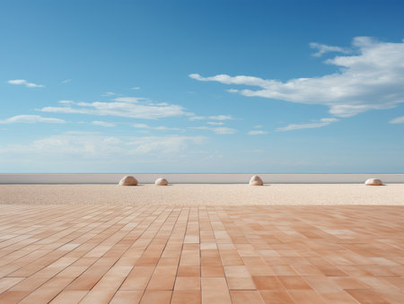 a brick walkway on a sandy beach with a blue sky in the backgroundの素材