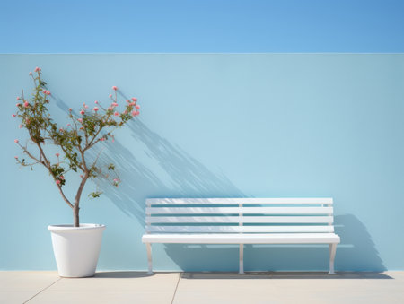 a white bench next to a flower potの素材