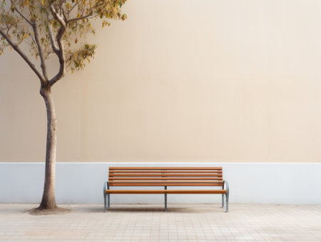 a wooden bench sitting in front of a treeの素材