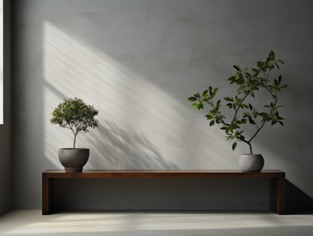 two potted plants sit on a wooden bench in front of a windowの素材