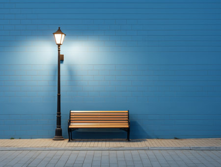 a bench sitting next to a street lamp at nightの素材
