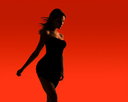 silhouette of a woman in a black dress on an orange backgroundの素材