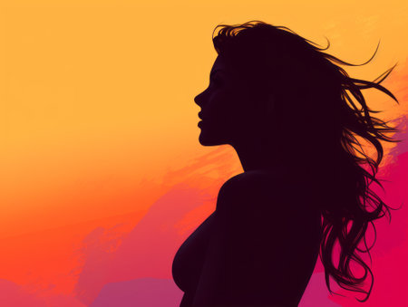 silhouette of a woman with long hair against a sunset backgroundの素材