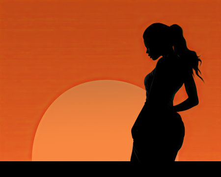 silhouette of a woman standing in front of an orange sunsetの素材