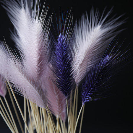 a bunch of purple and pink flowers in a vaseの素材