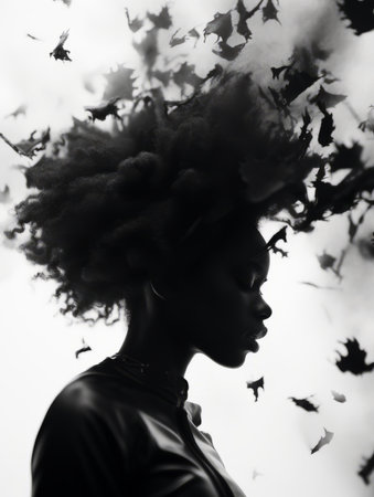 a black and white photo of a woman with her hair blowing in the windの素材