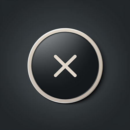 a black and white button with an x on itの素材