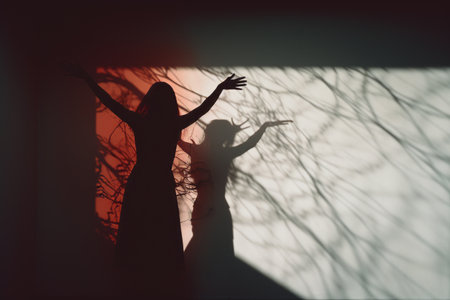 a shadow of a woman standing in front of a treeの素材