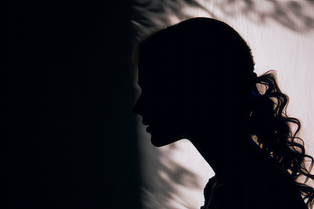silhouette of a woman in front of a windowの素材