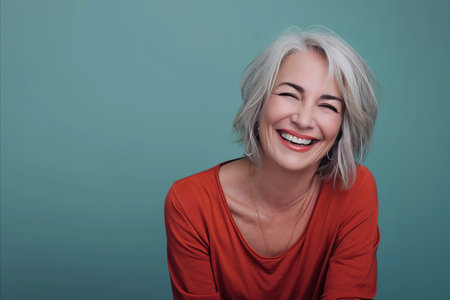 a woman with gray hair smiling and looking at the cameraの素材