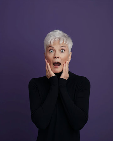 a woman with white hair and a shocked expression on her faceの素材