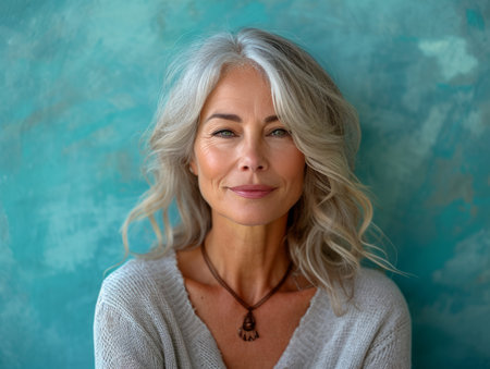 an older woman with gray hair posing for the cameraの素材