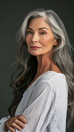 an older woman with gray hair posing for the cameraの素材