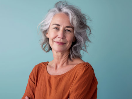 an older woman with gray hair posing for the cameraの素材