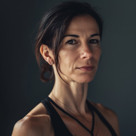 a woman with dark hair and a black tank topの素材