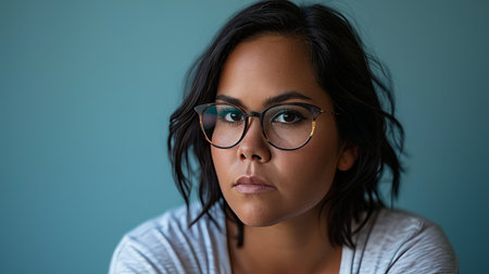 a woman with glasses looking at the cameraの素材