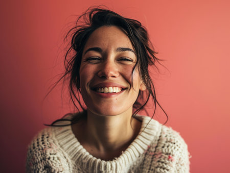 a woman is smiling and looking up at the cameraの素材