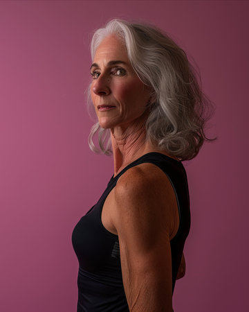 a woman with gray hair and a black tank topの素材